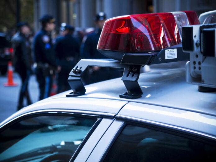 Police,Car,Lights,Close,Up.,A,Group,Of,Policemen,On