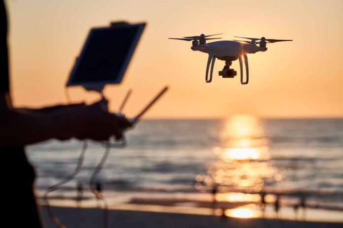 Drone,Operated,By,Young,Man,Flying,Over,An,Sea