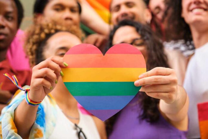 A,Group,Of,Lgbtq,People,Holding,A,Rainbow,Heart,Celebrating