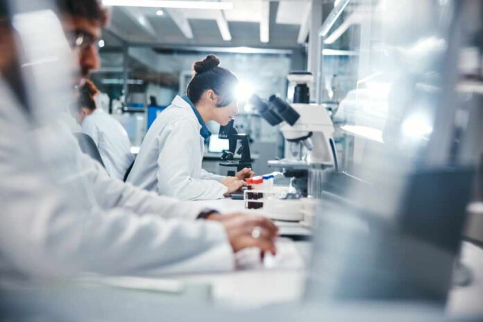 Medical,,Research,And,Scientist,In,Laboratory,With,Microscope,,Observation,And