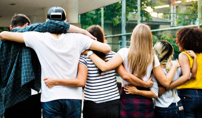 Smiling,Happy,Young,Adult,Friends,Arms,Around,Shoulder,Outdoors,Friendship