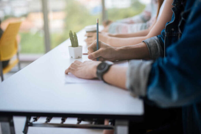 Closeup,Of,Hands,Students,Sitting,On,Lecture,And,Having,Test