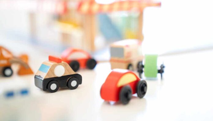 In,An,Indoor,Playground,,A,Wooden,Police,Car,Toy,Drives