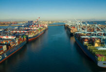 Aerial view of cargo ships docked at a shipping port