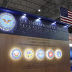 Display booth for the U.S. Department of Defense featuring security cooperation information