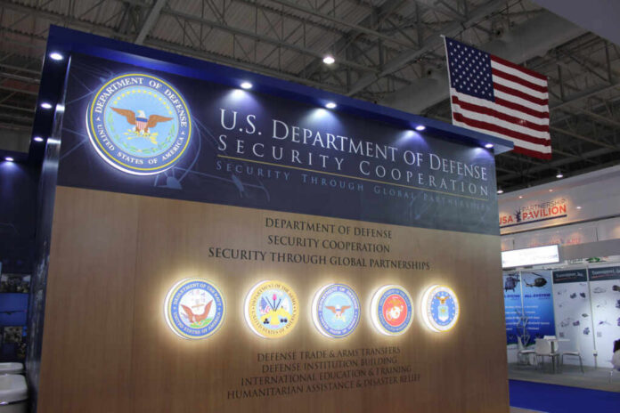 Display booth for the U.S. Department of Defense featuring security cooperation information