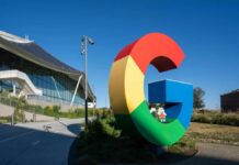 Huge Fines Rock Meta Google Empires Colorful Google logo sculpture in front of a modern building
