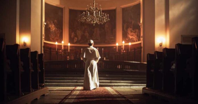 A religious figure standing in a church with candlelight and historic artwork