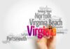 A hand holding a marker creating a word cloud of Virginia cities