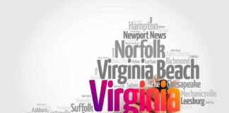 A hand holding a marker creating a word cloud of Virginia cities