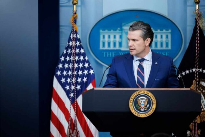 A government official speaking at a podium in front of the White House seal and American flag