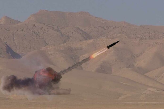 A missile launching into the sky with smoke and flames in a desert setting