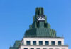 Top of a building featuring a prominent ABC logo against a clear blue sky