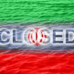 Graphic representation of the word 'CLOSED' overlaid on the Iranian flag with a water background