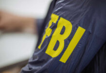 Close-up of an FBI agents jacket with yellow lettering