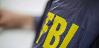 Close-up of an FBI agents jacket with yellow lettering