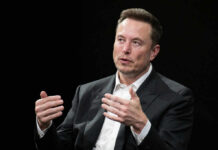 A business leader speaking during an interview, using hand gestures for emphasis