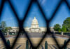 View of the U.S. Capitol building through a security fence