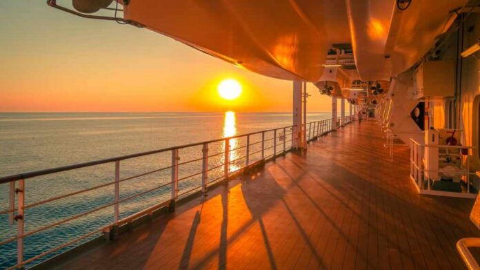 shutterstock_2370965197.jpg Sunset view from a cruise ship deck overlooking the ocean