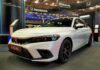 White Honda Civic displayed at a car exhibition