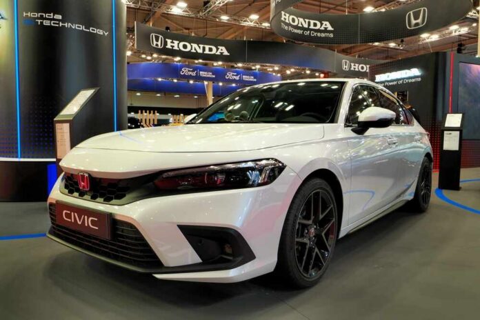 White Honda Civic displayed at a car exhibition