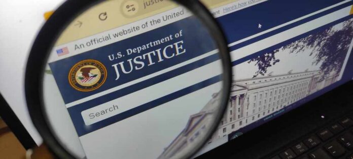 Matraman,,Indonesia,-,February,1,,2025:,The,U.s.,Department,Of Close-up view of the U.S. Department of Justice website through a magnifying glass