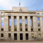 Baby-Murder Fury Explodes In Britain Facade of a government building with the words Law and Justice and a statue on top