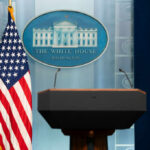 White House TRUST COLLAPSES Over Alleged Tapes Podium with microphones in front of the White House seal and an American flag