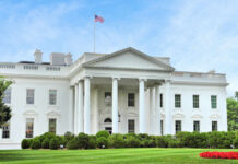 White House UFC Plot—Mom Rings Alarm The White House with an American flag flying above, surrounded by greenery