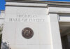 Exterior view of the Michigan Hall of Justice with the state seal