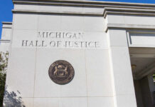 Exterior view of the Michigan Hall of Justice with the state seal