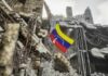 Venezuelan flag among ruins of a collapsed concrete building