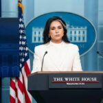 Biolab Network Exposed — Intel Scramble Begins Woman in white suit speaking at White House press podium