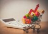 Inflation Spike Slams 3-Year High A shopping cart filled with colorful grocery items next to a calculator and an upward trend arrow