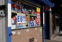 Convenience store window with EBT and ATM signs