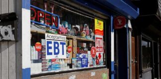 Convenience store window with EBT and ATM signs