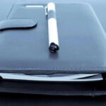 Diary Dump Sparks Trust Meltdown In D.C. Black leather planner with pen on top