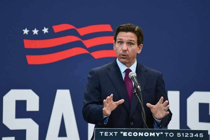 Man in suit speaking at podium with microphone