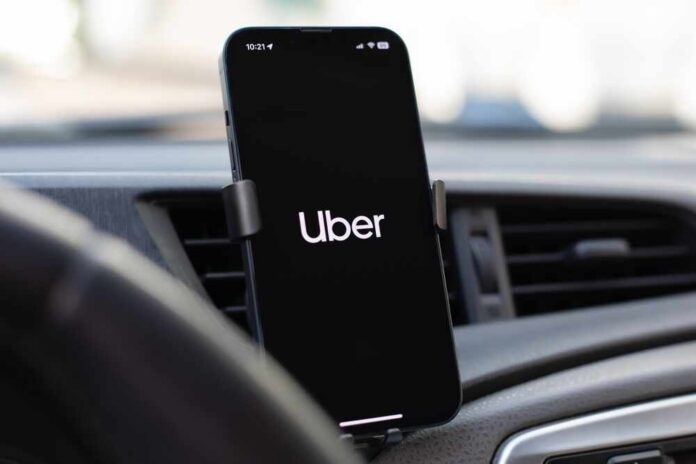 Smartphone displaying the Uber app in a car