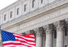 Army Strangling Plea Exposes Alarming Surge Facade of a United States courthouse with an American flag in the foreground
