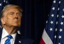 Power Games Exposed In Washington A political figure looking upward beside an American flag