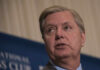 Senate Shockwave After Graham’s Sudden Death A man speaking at a podium during a conference