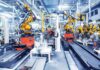 Industrial robots assembling parts on an automated factory line