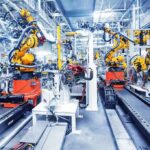 Automation Blitz Kneecaps Labor Power Industrial robots assembling parts on an automated factory line