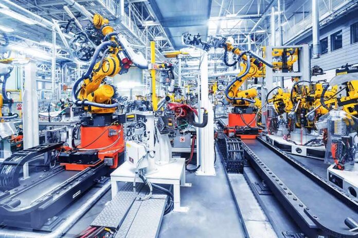 Industrial robots assembling parts on an automated factory line