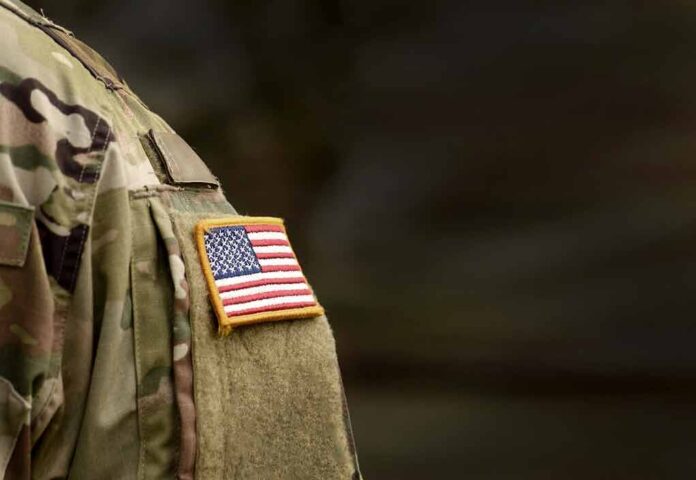 american flag patch on camouflage uniform sleeve