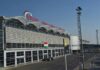 airport terminal exterior with modern facade and roadway