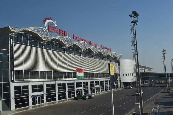 airport terminal exterior with modern facade and roadway