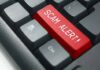Keyboard with red scam alert key
