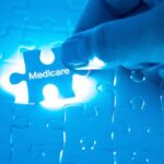 Fraud Crackdown Freezes Hospice Nationwide Hand placing a puzzle piece labeled Medicare